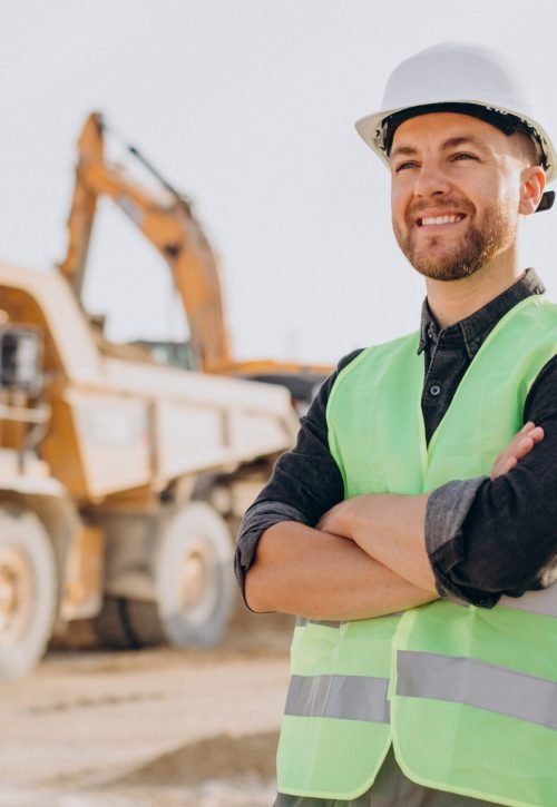 Male worker with bulldozer in sand quarry